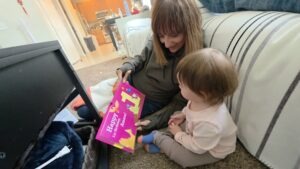 Reading book to granddaughter